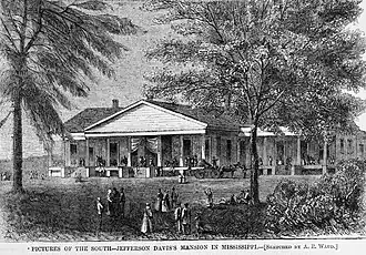 house with columns in the front, two trees- one right, one left- in foreground, figures walking on porch of building and in foreground.