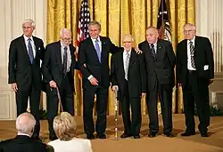 President George W. Bush presents the 2007 National Humanities Medal for the Monuments Men Foundation for the Preservation of Art to, from left, Robert Edsel and World War II veterans Jim Reeds, Seymour Pomrenze, Harry L. Ettlinger, and Horace Apgar.