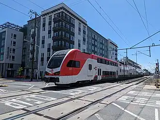 Stadler KISS EMUs are painted with red-on-white livery (2024)
