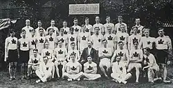 Black and white photo including four rows of athletes wearing white sweaters with a maple leaf crest