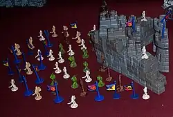 Pieces from several sets of Crossbows and Catapults, including warriors, flags, bricks, and towers