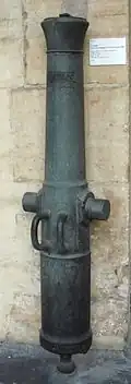 Rifled muzzle-loading gun "Canon de campagne de 4 rayé modèle 1858, L' Aubry". Caliber: 86 mm (3.4 in). Length: 1.43 m (4 ft 8 in). Weight: 327 kg (721 lb). Ammunition: 37 kg (82 lb) shell. Bronze, cast in Toulouse in 1859, re-tubed with steel.