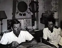 Captain R.T. White, DSO** in his cabin on HMS Cossack during the Korean War