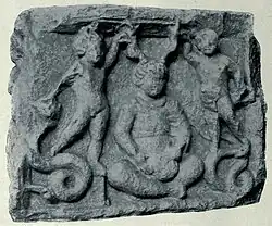 Cernunnos on an altar from Vendœuvres, Indre. Cernunnos, unusually youthful looking, is depicted between two genii atop serpents. : no 15 