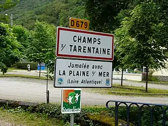 Road signs entering Champs-sur-Tarentaine-Marchal, on the D679 road