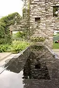 Gravel Garden with reflecting pool near ruin.