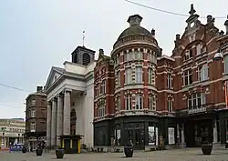St. Antoine's Church (left) with the Passage de la Bourse (right)