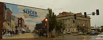 Livingston County Courthouse with mural depicting the community being the home of sliced bread. The district around the courthouse is on the National Register of Historic Places.