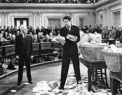 Paine and Smith in the Senate, with Smith holding letters and telegrams demanding his resignation in the final scene