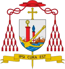 A coat of arms showing a big anchor in gold, a brown ship with a silver sail with a red cross on the see. On the background, an orange city skyline with a characteristic skyscraper. Towering over the skyline, a red pillar with a radiant gold custody and a lower red pillar with a blue Madonna. The background is silver. Behind the coat itself, a gold crozier. Above the coat of arms a red cardinal's hat. From the hat, cardinal strings hang to the sides. Under the coat of arms a red scroll with the black motto "IPSI CURA EST".