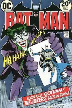 "Batman" cover, with the Joker holding an ace of spades with Batman on it