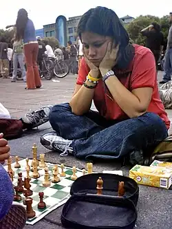 A girl playing chess in Mexico City, Mexico
