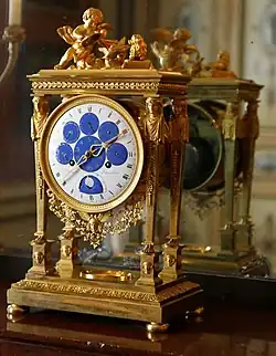 Astronomical clock; by Philippe-Jacques Corniquet; c.1794; gilt bronze and enamel face; unknown dimensions; Musée des Arts décoratifs, Paris[75]