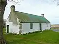 Derelict Cotter house by Croy church