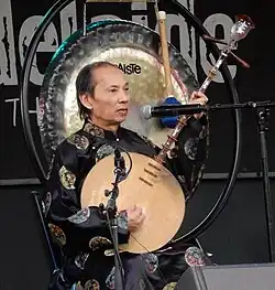 Vietnam, đàn nguyệt literally means "moon string-instrument" (đàn is the generic term for "string instrument" and nguyệt means "moon"). Image taken in Australia, 2017