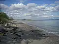 The public southern sandy beach with a view to the seabath structure.