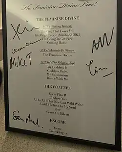 A typed list of songs, with autographs of the band members