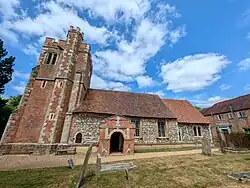 The Church Of England parish church of St. James The Less at the village of Dorney, Buckinghamshire, England. June 2025.