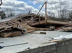 A destroyed outbuilding