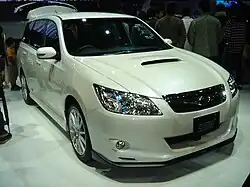 Subaru Exiga 2.0GT tuned by STI, a high-performance variant of the standard Subaru Exiga minivan. This photo shows the front of the car, which is white; the rear hatch is open.