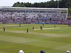 A colour photograph of a stand at a cricket ground