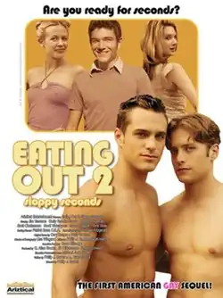 Image depicts Troy and Marc at the forefront, from the waist up, standing next to each other. Both men are shirtless, and looking directly into the camera. The background features Gwen, Kyle, and Tiffani from the waist up, looking at the camera and smiling, with Tiffani having most of her back turned.