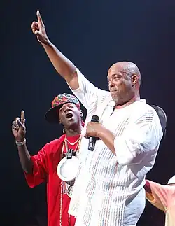 Ecstasy and Flavor Flav onstage at a festival