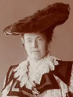 Black-and-white portrait of Edith Kermit Roosevelt, a middle-age white woman, wearing ornate clothing.
