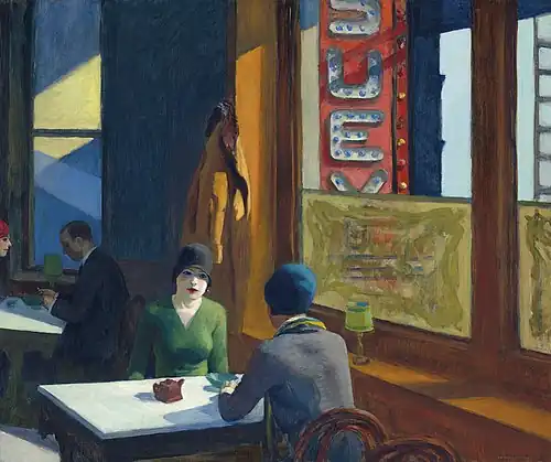 Two women sit at a small table inside a sunlit Chinese restaurant