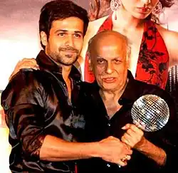 Emraan Hashmi is posing with Mahesh Bhatt