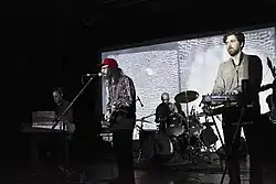 The band performing onstage