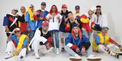 Ex Battalion in 2021 (Clockwise from top right: Flow G, then-member Honcho, Emcee Rhenn, Jnske, Cent, E.I.J, Jekkpot, King Badger, Skusta Clee, JRoa, Bullet-D, Huddass, Yuridope, and Brando)