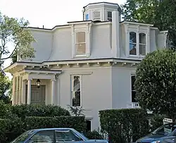 A similar arrangement of masonry ground floor and timber frame second floor, but built in a decorative style typical of San Francisco. Feusier Octagon House, San Francisco, California (built 1857).