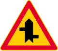 Junction with a minor road (formerly used )