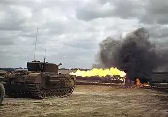 A Churchill tank fitted with a Crocodile flamethrower in action.