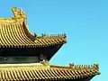 Yellow tiles and figures on the roof the Hall of Supreme Harmony in the Forbidden City