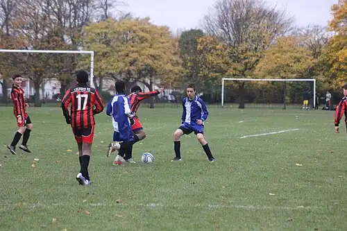 Boys play football in Charlton Park (November 2013)
