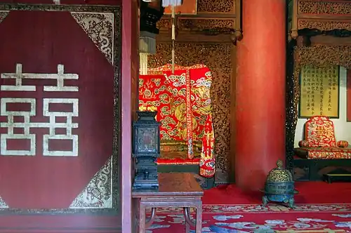 A room with traditional Chinese wedding decorations and rugs, Forbidden City in Beijing