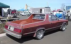 Rear 3/4 view, showing fiberglass cargo bed conversion