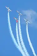 Four North American NA-88 Harvards climbing vertically into a loop (2021)