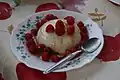 Raspberry dessert with fresh cheese and honey