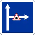 Level crossing with gates on side road