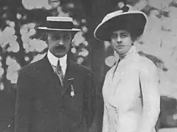 Frances and her husband stand side by side