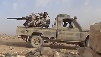 Technical armed with a ZPU-2 heavy machine gun operated by the Free Syrian Army during clashes with ISIS in the eastern Qalamoun Mountains, southern Syria, 2017