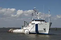 A recovery boat with a recovered Solid Rocket Booster
