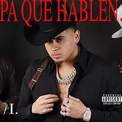 A man wearing a Tejano hat, neck chains and cowboy attire. Short-width upper text is read as "Pa Que Hablen.", all uppercase, while the text "I." is read on the bottom-left corner and a Parental Advisory logo is seen on the right.