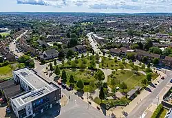 Photo of Gainsborough Square in Lockleaze, Bristol, UK taken from a drone. The Fedden Buildings (home to the Lockleaze Neighbourhood Trust community centre) is prominent in the bottom left of the picture.