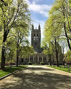 Gaston Hall with a tree-lined path