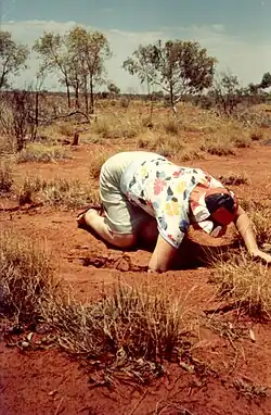 Joan Carpenter with her hand in the earth