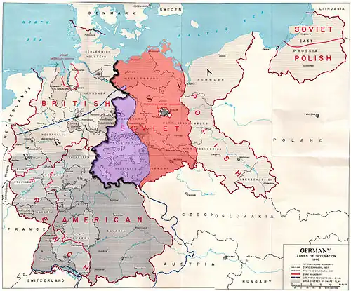Map showing the Allied zones of occupation in post-war Germany, as well as the line of U.S. forward positions on V-E Day. The south-western part of the Soviet occupation zone, close to a third of its overall area, was west of the U.S. forward positions on V-E day and is marked in purple; the other two-thirds of the Soviet occupation zone are marked in red.